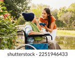 Small photo of Asian family, grateful daughter takes care of mother who is sick and disabled with paralysis, feeds her food to restore her body and keep her healthy : Elderly insurance health care concept