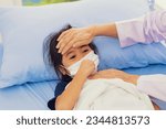 Small photo of Female doctor touching forehead attentive treating influenza symptoms young girl who is sick weak infected with virus wearing medical mask treating the sick hospital bed hospital treatment room.