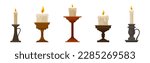 burning candles in candlesticks ...