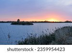 Small photo of Spectacular sunset with clouds in the Donana National Park. Tarelo lagoon and Bonanza marshes. Sanlucar de Barrameda, province of Cadiz, Spain