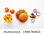 Small photo of Bbq hamburgers with fries isolated on white. Top view