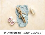 Baby boy newborn bodysuit with toys and accessories, flat lay