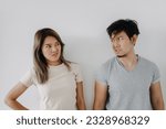 Funny angry face asian couple mad and fight at each other isolated on white.