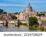 Classic Rome cityscape with St Peter's basilica in Vatican and St. Angel bridge over Tiber, Italy