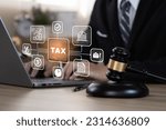 Busines using a computer to omplete income tax return form online. Calculation tax return concept.
