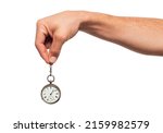 Man's hand holds a clock on a white background, isolated