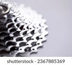 Close-up of bicycle roller chain that transfers power from pedals to drive. Macro shot of metal wheel detail. Rear cassette in mountain bike. Transport component concept