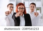Small photo of A group of business people pointing their finger at the camera and saying. We choose you are engaged in a posse of employees and selecting the prosessians for the customer.