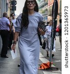 Small photo of MILAN, Italy- September 19 2018:Veronique Tristram on the street during the Milan Fashion Week.