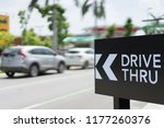 Drive thru sign with blur Car on background