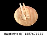 Woodcraft plate and spoon for interiors and kitchen tools made from pinewood.
