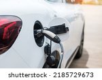 Electric car charging battery at EV charger station or home. green energy power, Eco friendly alternative, technology and environment concepts
