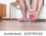Small photo of man having barefoot pain due to Plantar fasciitis and bunion toes or blister due to wearing narrow shoes and waking or running longtime. Health and medical concept