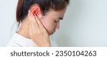 Small photo of Woman holding her painful Ear. Ear disease, Atresia, Otitis Media, Inflation, Pertorated Eardrum, Meniere syndrome, otolaryngologist, Ageing Hearing Loss and Health concept