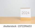 Small photo of 2024 Year Calendar on table background. Happy New Year, Resolution, Goals, Plan, Action, Mission and financial Concept