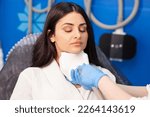 Small photo of coolsculpting procedure in cosmetology clinic, cosmetologist doctor makes procedure for removing fat from the chin to patient