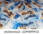 Small photo of Swiss banknotes background. Swiss francs in denomination of 100