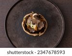 Small photo of Exquisite Mushroom Truffle Pastry: An Elegant Culinary Delight for Fine Dining Enthusiasts. Perfect Starter for a Memorable Gastronomic Experience.
