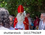 Small photo of Rio de Janeiro, Brazil - December 1, 2019: Vice consul of The Netherlands with Sinterklaas and his assistants on the city lake shore in Rio de Janeiro where Dutch community has gathered