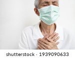 Small photo of Asian senior grandmother suffering from pain in chest with acute dyspnea or asthma disease,Tired old elderly eyes closed and hand touch her chest,difficulty breathing,shortness of breath,breathless