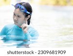 Small photo of Upset asian teen girl had tinnitus,problem with water entering the ear canal while swimming,female people cleaning ears after diving in swimming pool,otitis externa,swimmer's ear,health care concept