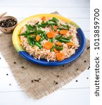 Small photo of Healthy food. Rise basmati with vegetables. Vegan food. Basmati rice, pakistani basmati, asian basmati, cooked white rice, in a plete on a wooden table.