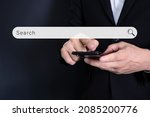 Data Search Technology Search Engine Optimization. man's hands are using a computer smartphone to Searching for information. Using Search Console with your website.