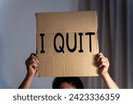 Small photo of Resignation. businessman holding boxes for personal belongings and I QUIT letters.Quitting a job.The great Resignation. Note text I QUIT.