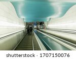 Escalator in a modern metro. Beautiful design of the station. Blurred.