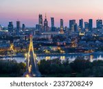 Evening aerial panorama of Warsaw city center, Vistula river and Swietokrzyski bridge