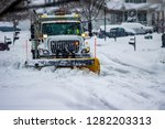 White Snowplow Truck With...