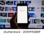 Small photo of Facebook is down, Instagram, WhatsApp, Messenger trouble. Hand with iphone with open Facebook Page cannot be open on Facebook logo background. Kropivnitskiy, Ukraine, October 04, 2021