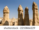 Small photo of Famous Phallic shaped rock formations known as fairy chimneys in Love Valley, caused by volcanoes, near Goreme, Cappadocia, Anatolia, Turkey