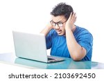Small photo of student shrieking expression by looking at laptop screen, surprised expression of a student in front of laptop
