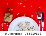 on a red background in a plate... | Shutterstock . vector #765619813