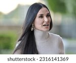 Small photo of STOCKHOLM, SWEDEN - JUNE 11, 2023: Demi Moore before entering the Max Mara fashion show in Stockholm City Hall.
