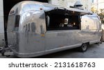 Small photo of Bordeaux , Aquitaine France - 02 28 2022 : Airstream Travel Trailer used as trendy fashion food truck