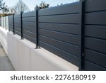 Small photo of wall grey modern barrier and fence of private individual house of suburb house design protection view home garden