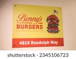 Small photo of Hawkins , USA - 08 01 2023 : Benny's Burgers of Stranger Things movies restaurant brand sign text and logo facade us fast food restaurant