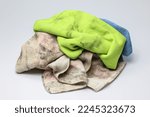 Pile of dirty rag suspended isolated on white background.