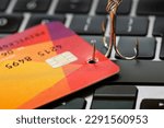 Small photo of Phishing email cyber crime, fishing hook with credit card on computer keyboard, online spam email concept.