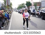 Small photo of Marathon race in Magelang Indonesia, people set foot on city roads a distance of 5 and 10 kilometers. In the provision of funny gimmick to make it fun. : MAGELANG, Indonesia 18 september 2022