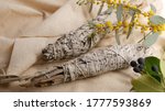 Small photo of Dried white sage smudge stick, relaxation and aromatherapy. Smudging during psychic occult ceremony, herbal healing, yoga or aura cleaning. Essential incense for esoteric rituals and fortune telling.