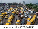 Small photo of People going about their daily activities were seen at a busy bus park in Lagos, NIGERIA, on August 19, 2022. Daily life in Lagos, Nigeria’s largest city, despite the rapidly increasing cost of living