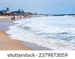 Small photo of Waves gently roll along the shoreline beach in Lagos, Nigeria, November 2019. Holiday season in Lekki