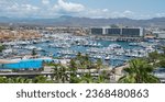 Small photo of Cabo San Lucas BCS Mexico Aug 15 2023 Areal view of the city and thye Marina on summer vacations season , tourism at this time of years increases as we can see in the Yachts affluence in the marina