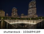 9 11 memorial shot at night with building in the back