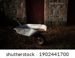 An Old Rusty Wheelbarrow In...