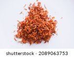 Small photo of Dried safflower for herbal tea on white background, dry safflower petals, Saffron substitute