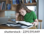 Small photo of tired overworked girl, exhausted young woman in glasses college or university student is study hard in library, lesson, problem with eyes, myopic purblind. Vision eyes problems, myopia, blindness.